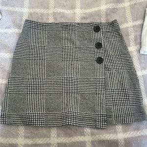 a black and white plaid skirt